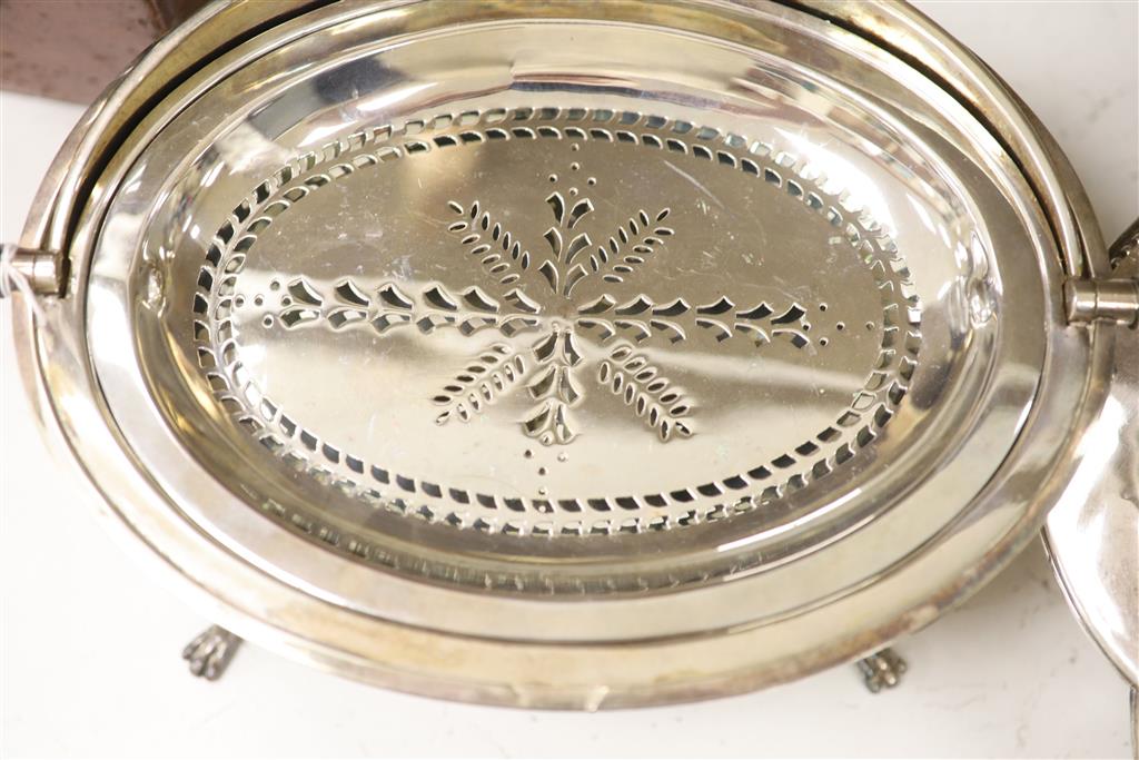 A good quality late 19th century silver-plated warming dish, of clover form, with a shaped cover,